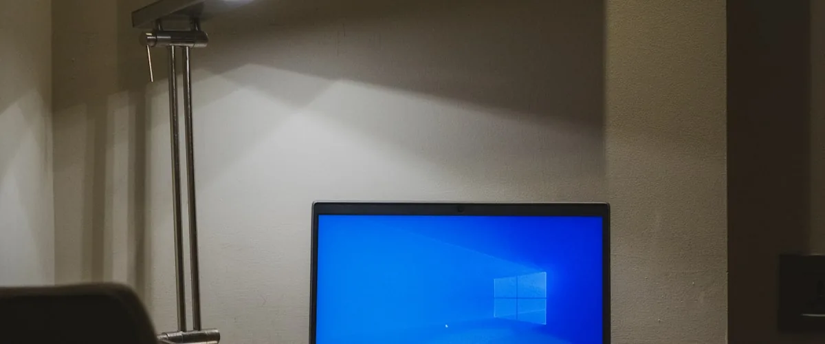 Laptop and headphones on a clean desk